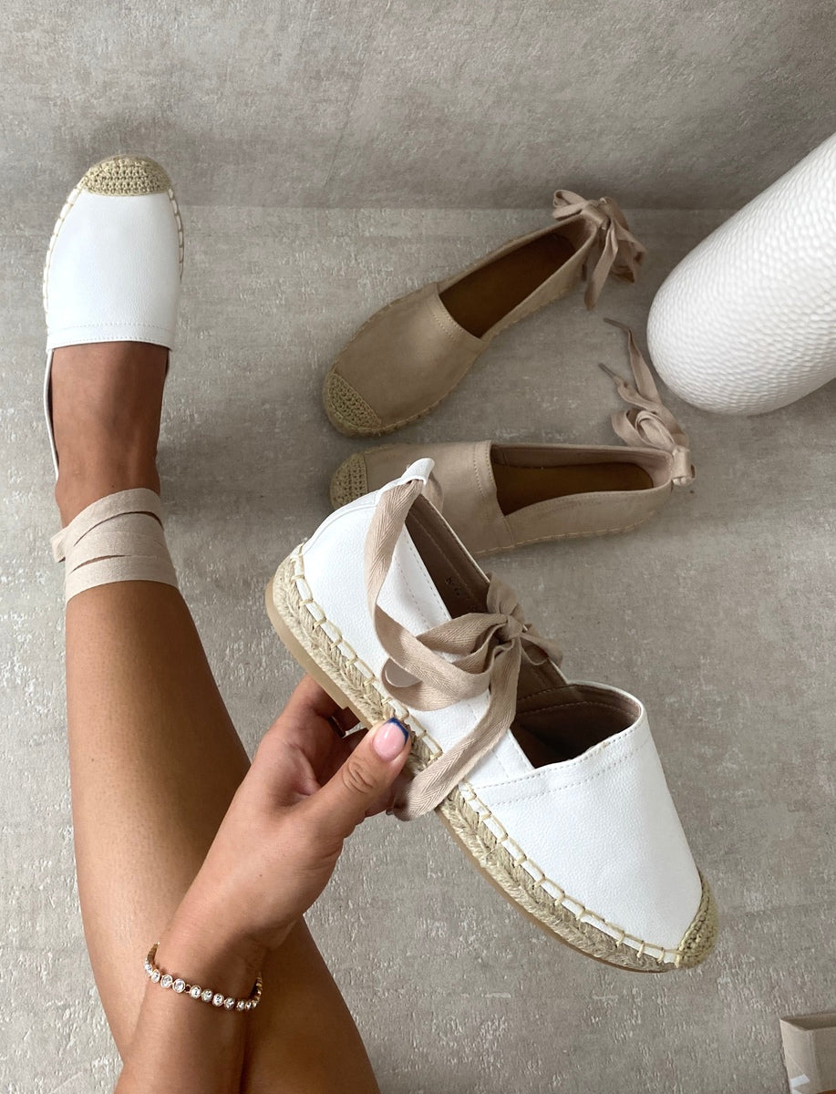 Espadrilles with ankle ties, woven jute toe caps, and braided platform sole