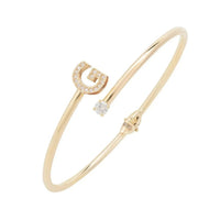 Gold bangle with crystal G charm and small round stones