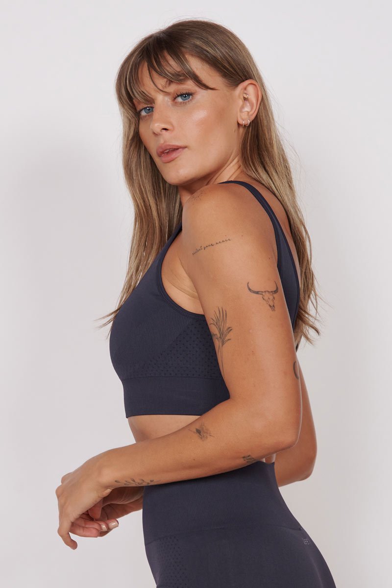 Petite seam-free sports bra in navy, racerback and side profile, sleeveless