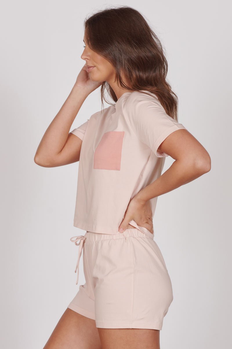 Light pink short pyjama set with square contrast pocket and side-tie drawstring shorts