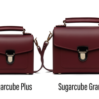 Pair of marsala leather satchel handbags with flap and front clasp, small and large