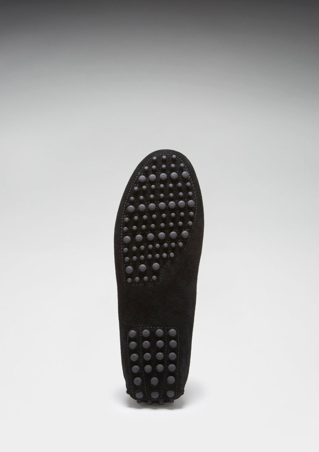 Driving loafer outsole with raised rubber grip dots across the sole.