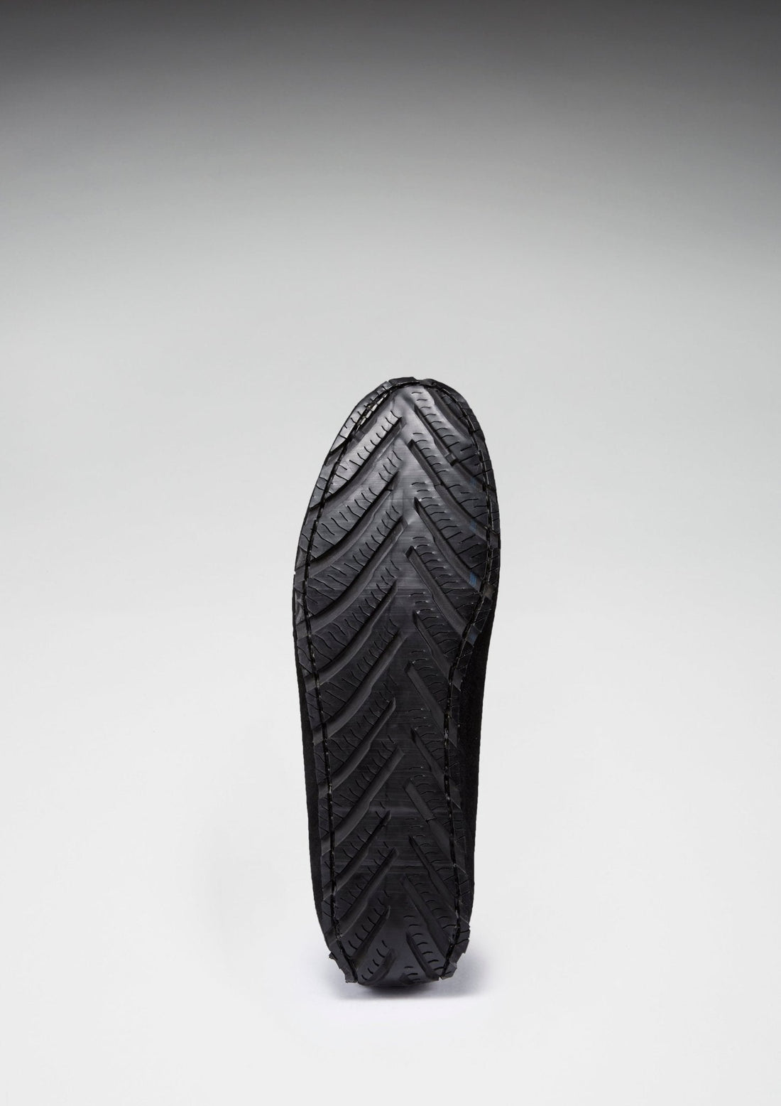 Driving loafer outsole with textured tread and heel grip