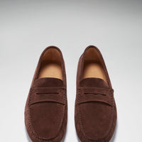 Pair of brown suede penny driving loafers, viewed from above