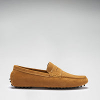 Side profile of a tan suede penny loafer with a low rubber pod sole.