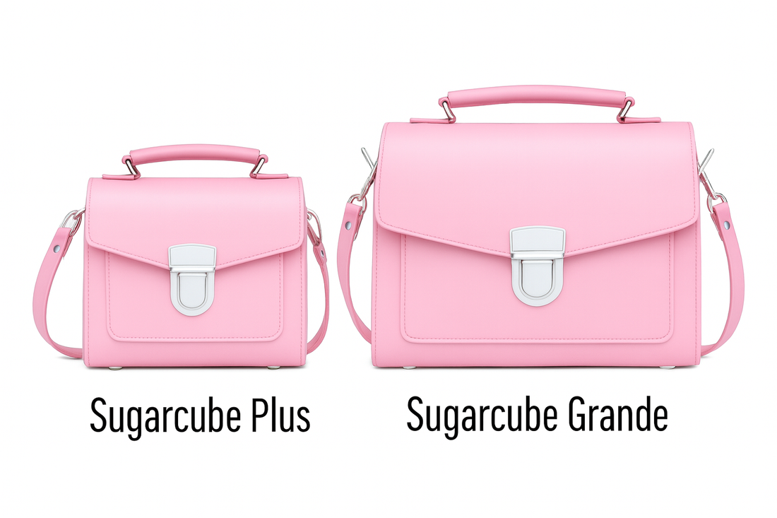 Two pastel pink leather flap handbags side by side, each with metal buckle clasp.