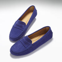 Pair of ink blue suede penny driving loafers with tan lining and stitched toes