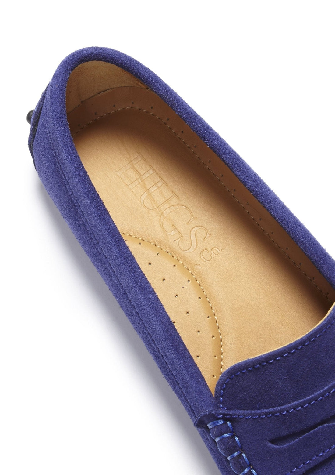 Ink blue suede loafer detail showing tan insole and Hugs & Co. branding