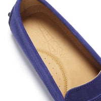 Ink blue suede loafer detail showing tan insole and Hugs & Co. branding