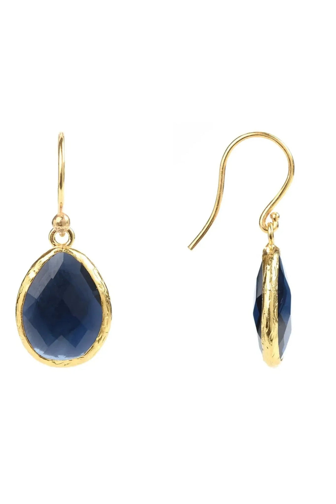 Gold drop earrings with dark blue teardrop faceted gemstones, side view