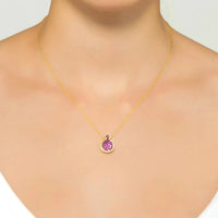 Gold necklace with ruby-pink crystal-set pomegranate pendant on a fine chain