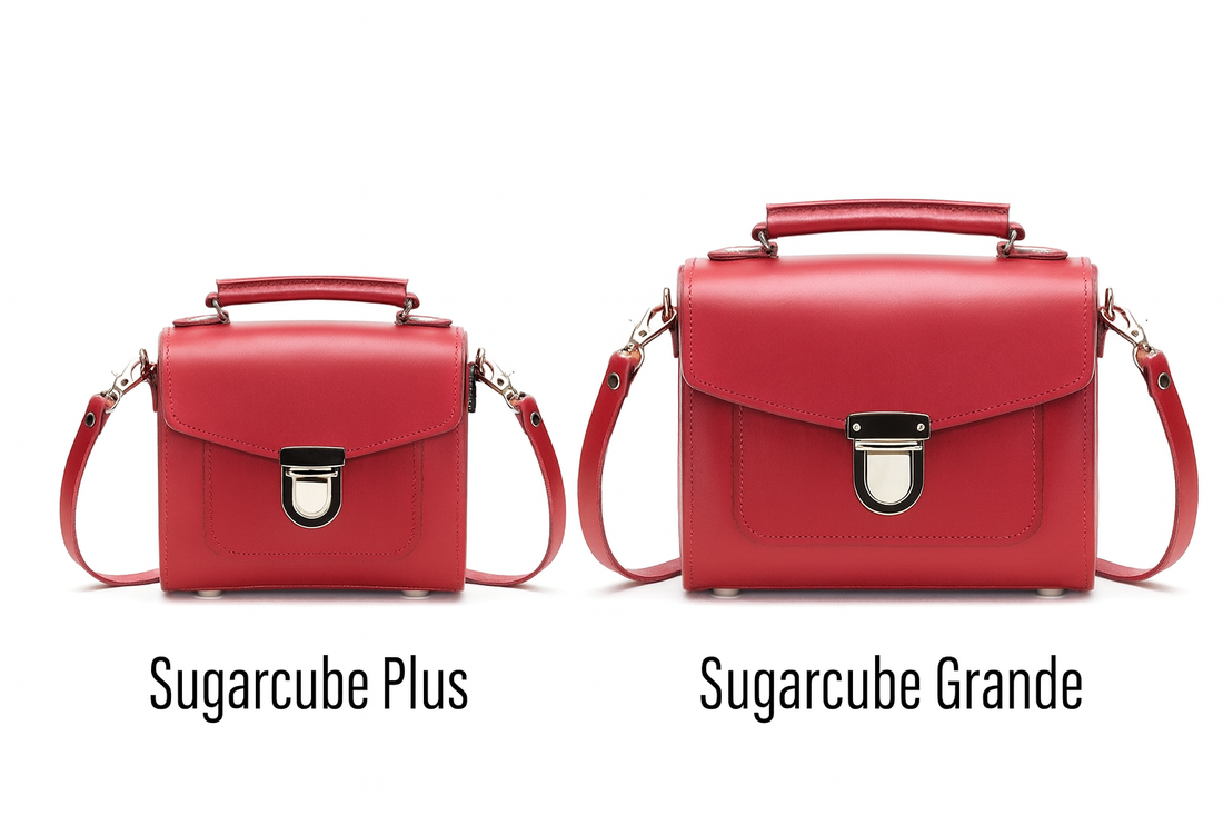 Pair of red leather square handbags with front flap and silver clasp, short top handles