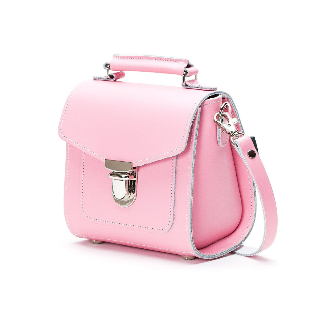 Pastel pink leather flap crossbody bag with metal clasp and adjustable shoulder strap.