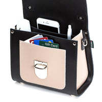 Black leather handbag with card and phone compartments, beige front panel