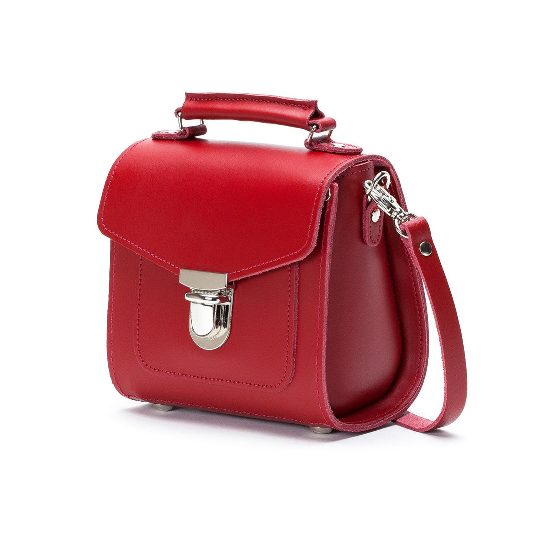 Red leather handbag with curved flap, silver clasp, side view, and shoulder strap