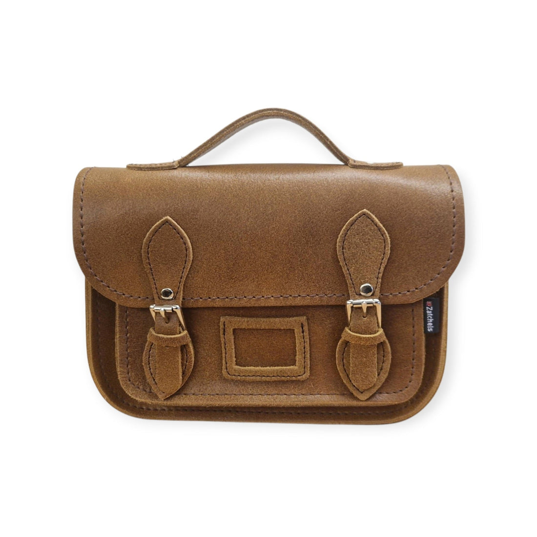 Tan leather midi satchel with flap, buckle straps, and front patch pocket