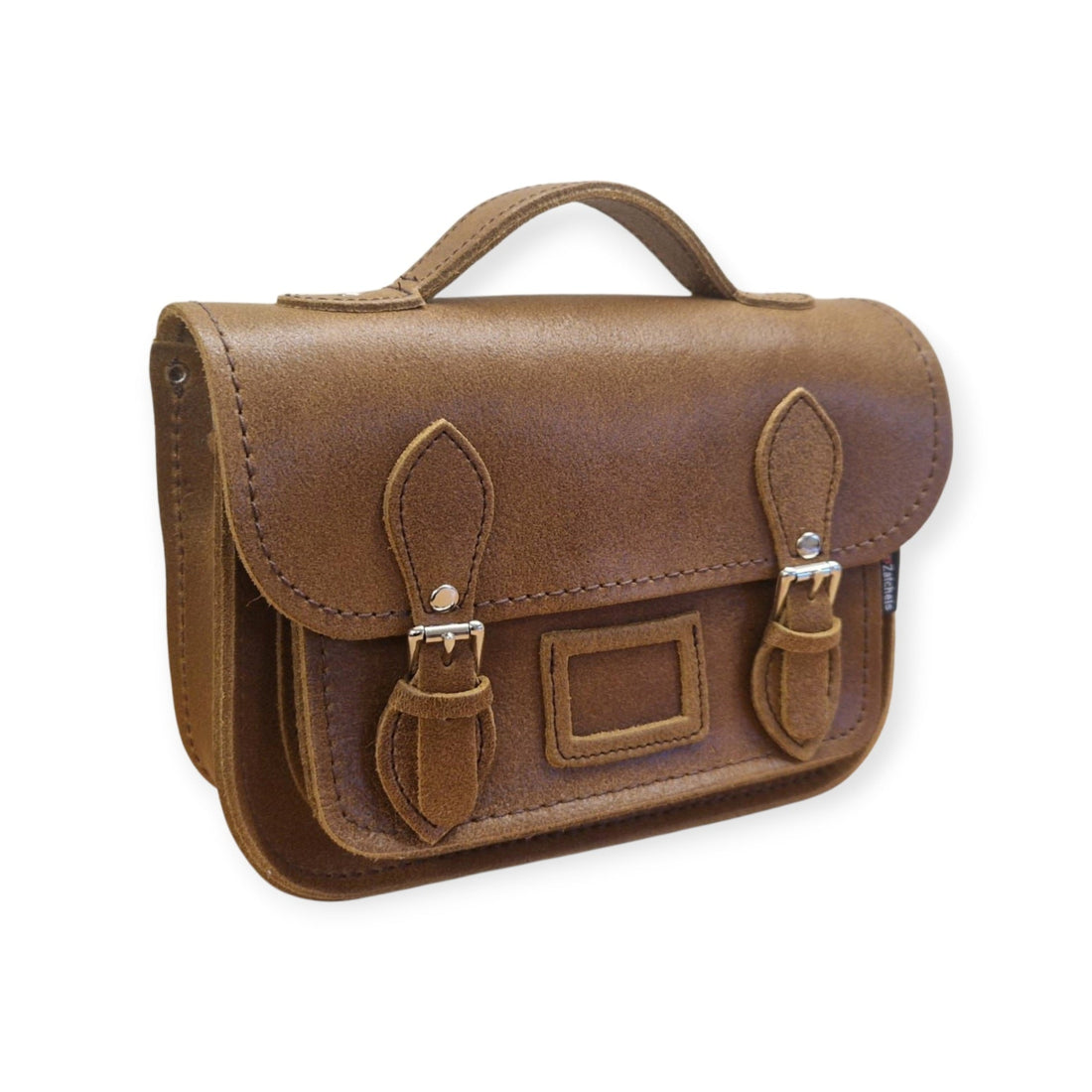 Tan leather midi satchel with flap and buckle straps, side view
