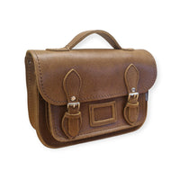 Tan leather midi satchel with flap and buckle straps, side view
