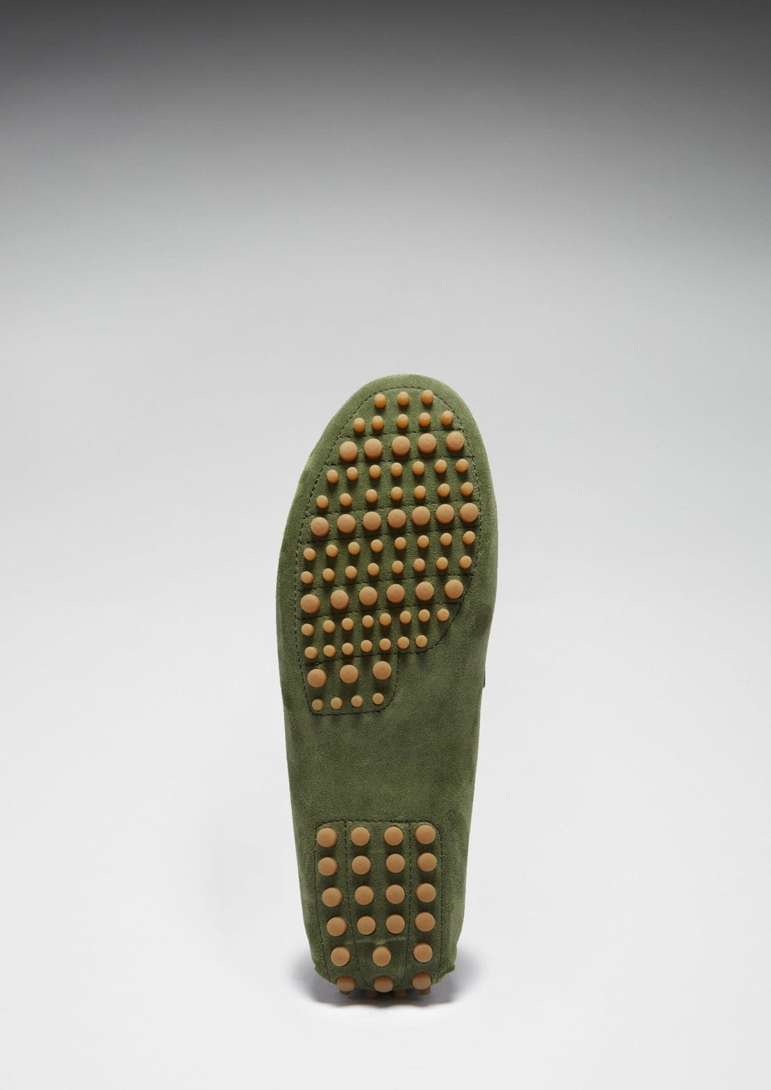 Green suede loafer sole with tan rubber driving-grip studs