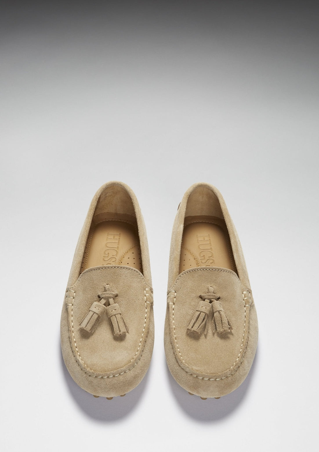 Pair of suede tassel loafers shown from above