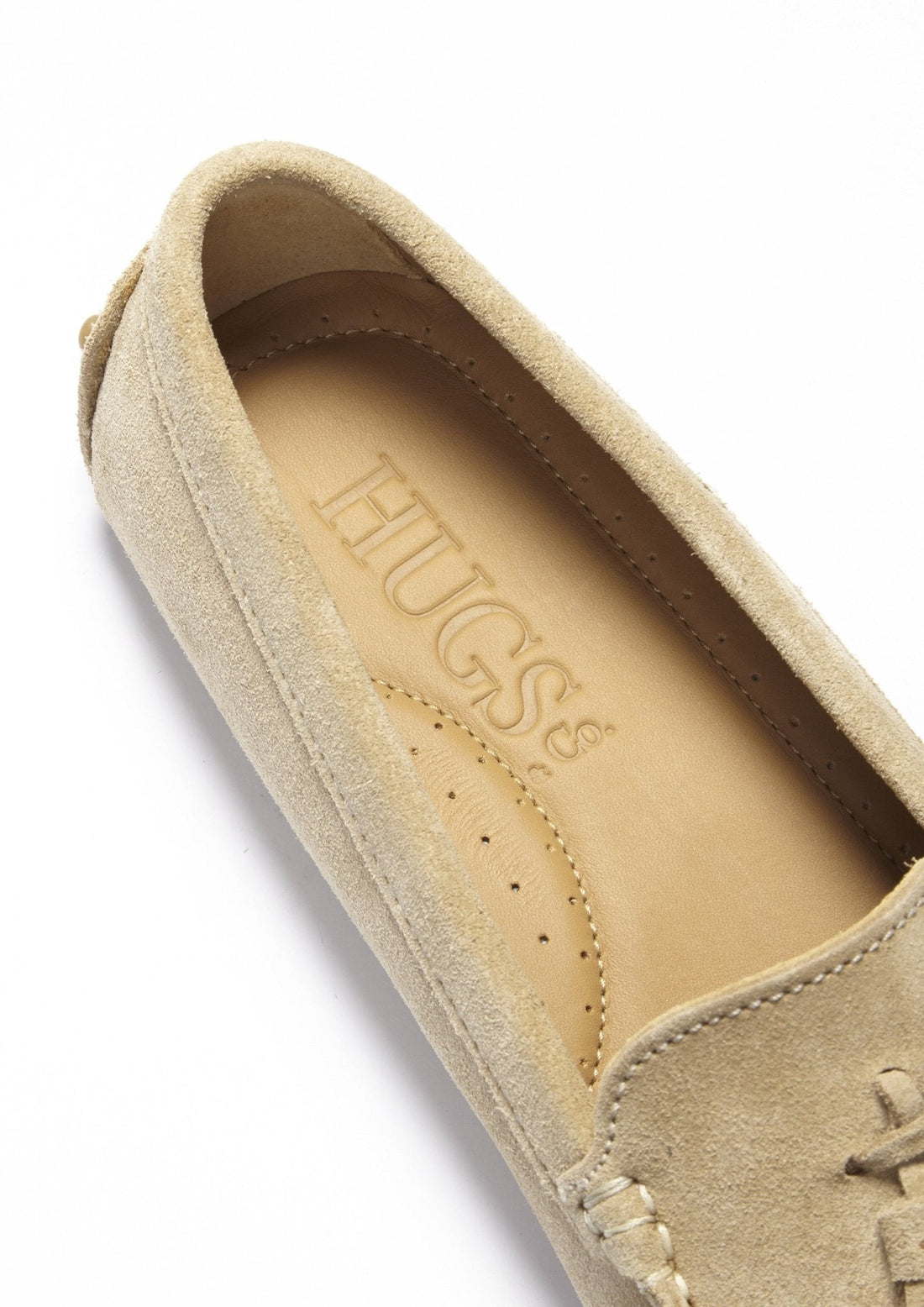 Suede loafer interior with HUGS® branded insole and perforated footbed