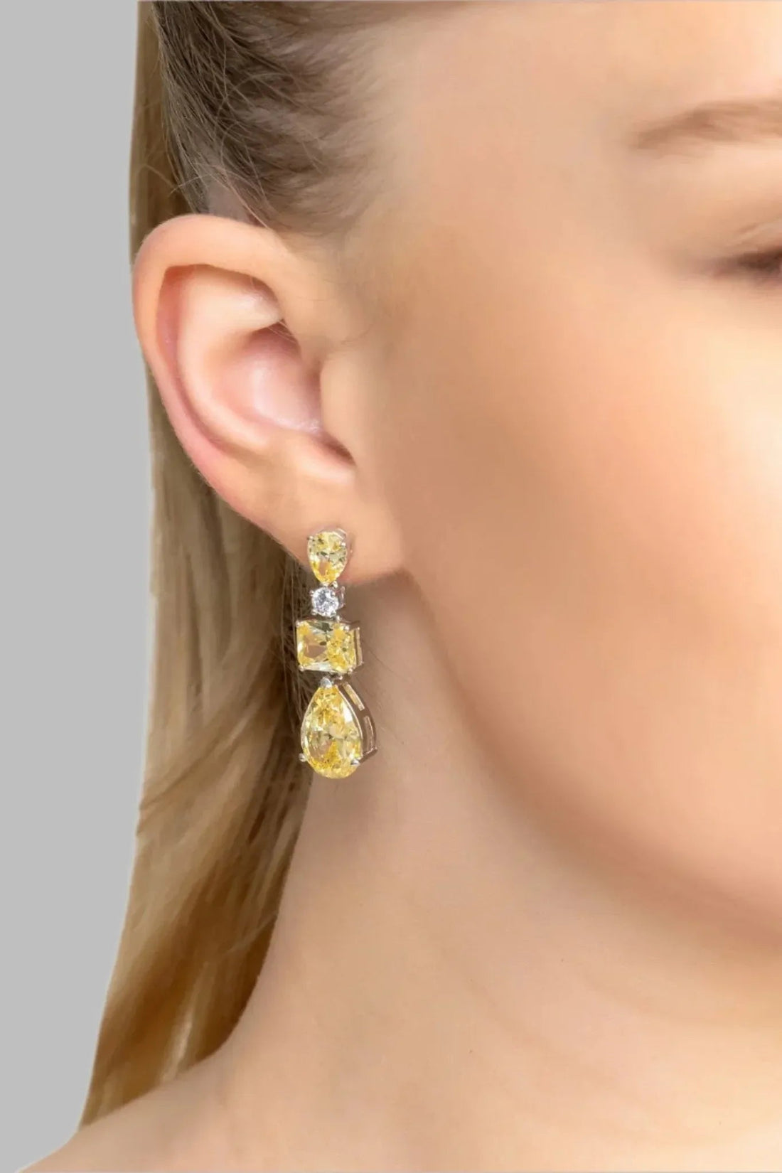 Silver drop earrings with yellow topaz teardrop and dark stone accents