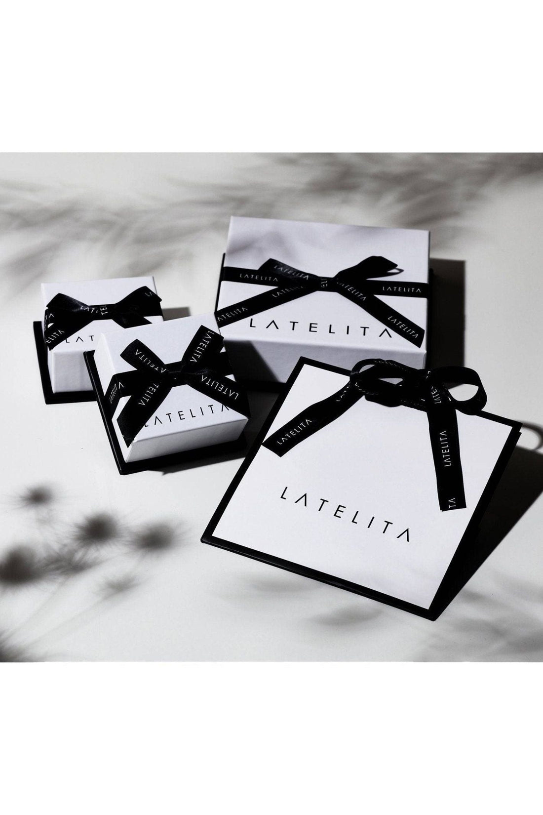 Gift boxes for ruby pendant necklace with black ribbon and LATELITA tags