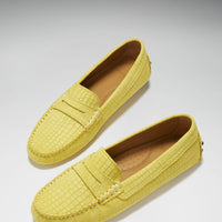 Pair of yellow embossed suede penny loafers with tan lining
