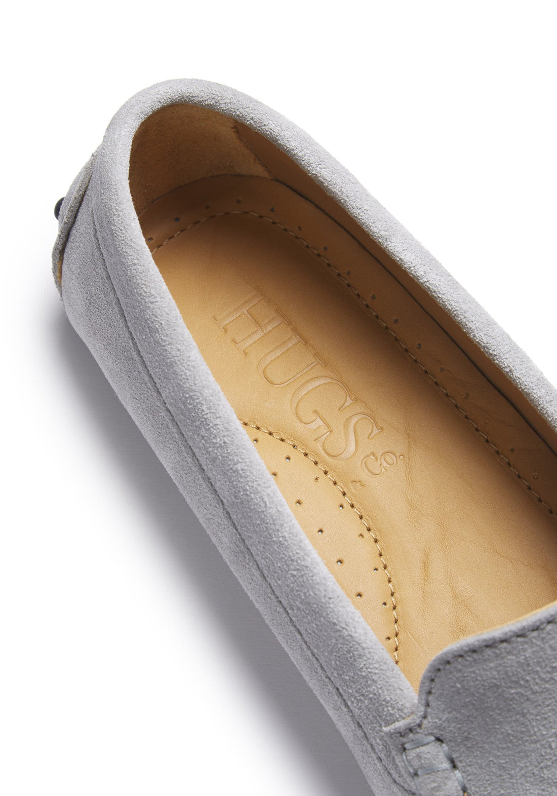 Close-up of grey suede loafer with tan Hugs & Co. insole.
