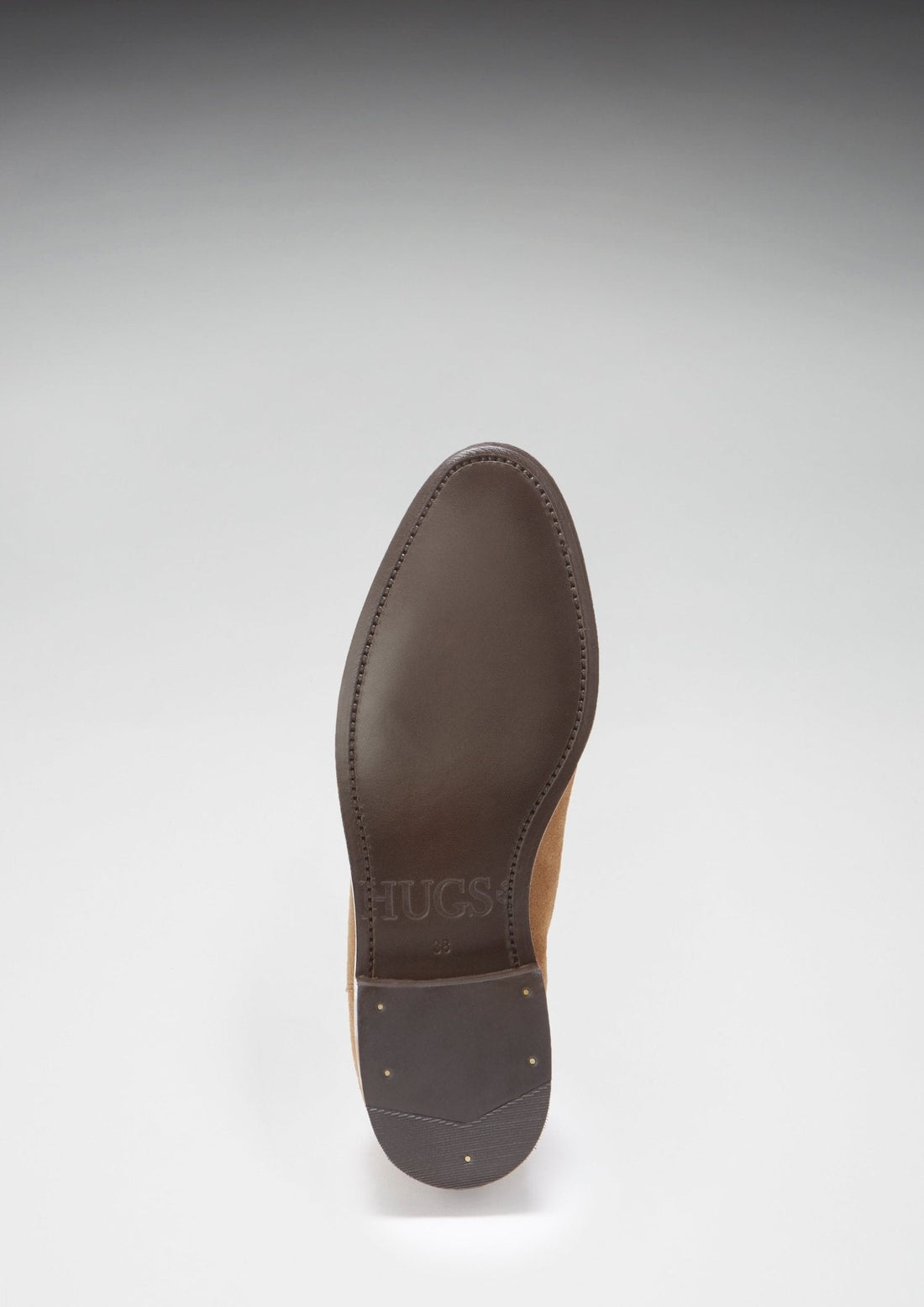 Chelsea boot with a dark leather sole and small heel studs.