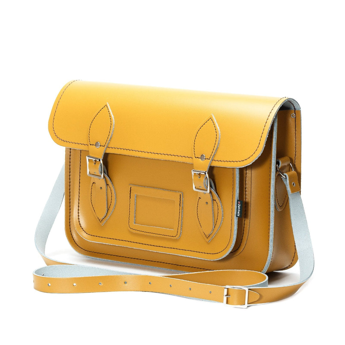 Yellow ochre leather satchel with flap closure and front buckles, shown from side angle