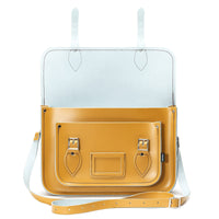 Yellow ochre leather satchel with light interior lining and flap front pocket, shown open