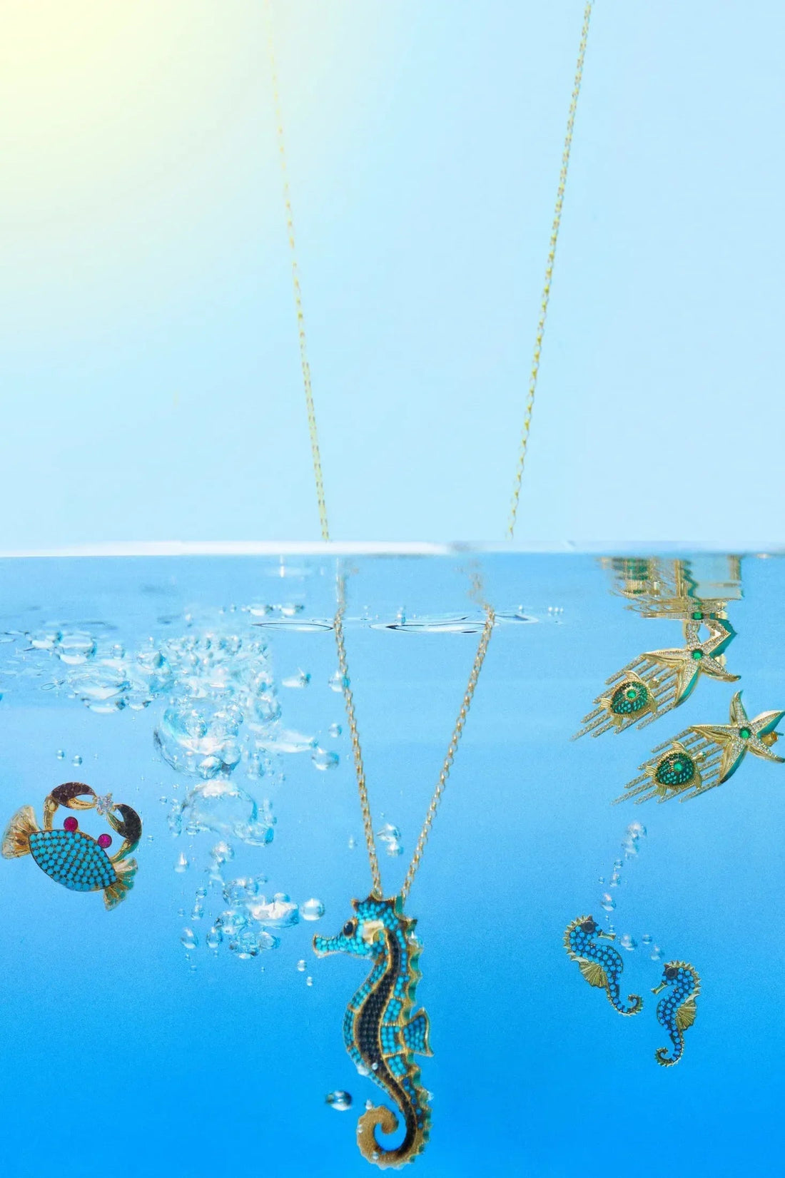 Turquoise seahorse charms with gold-tone chain links