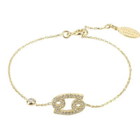 Cancer zodiac bracelet with gold-tone chain and oval crystal crab face charm