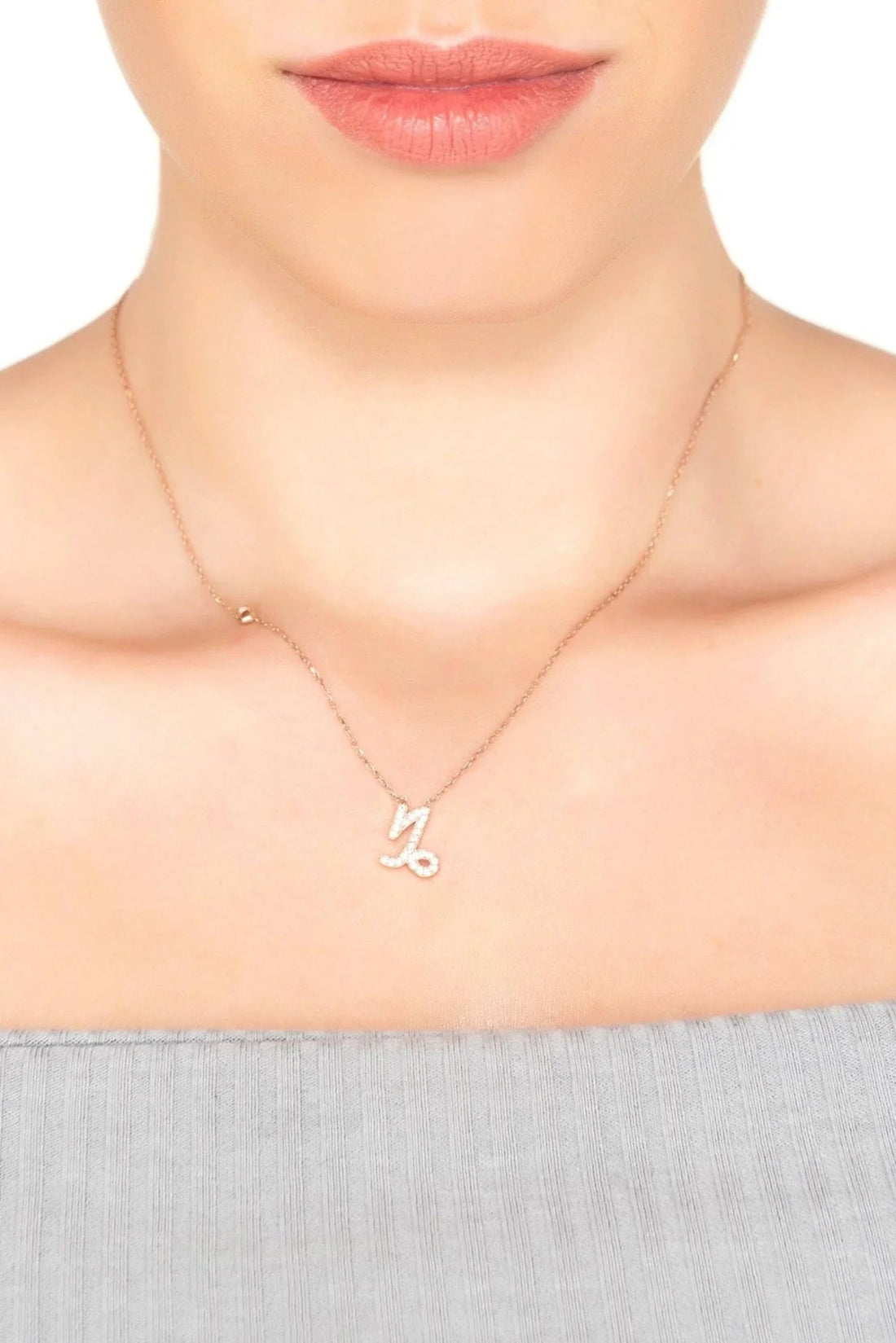 Rose gold Capricorn charm pendant necklace on model&